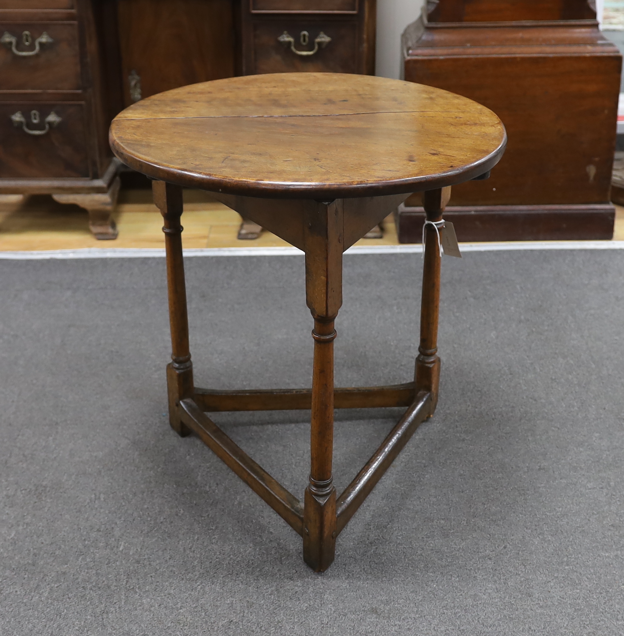 A 19th century fruitwood cricket table, diameter 53cm, height 56cm